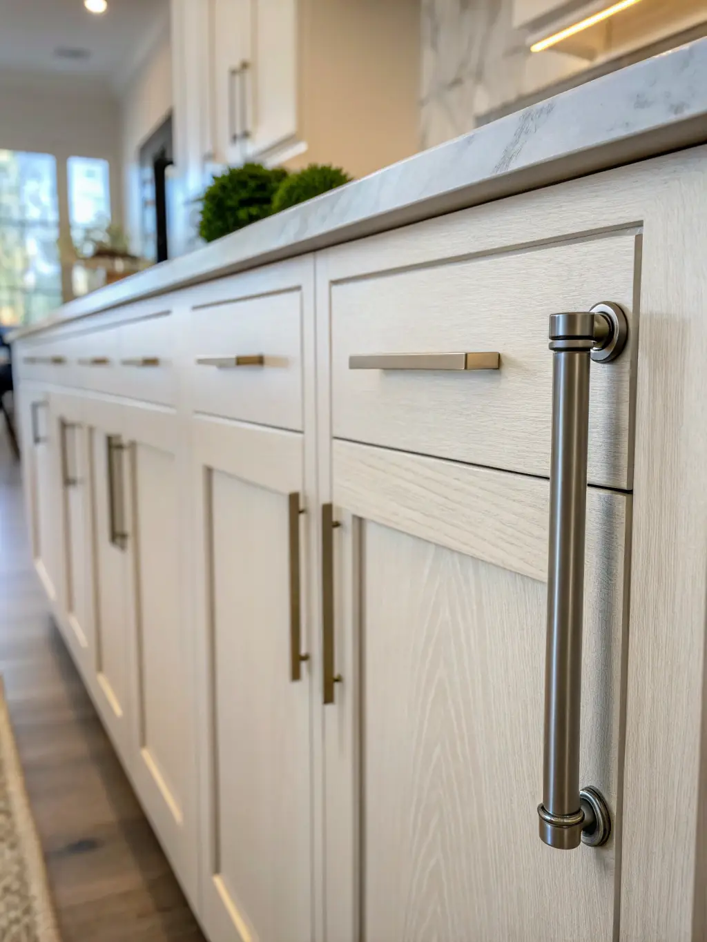 An image displaying different handle and knob styles on cabinet doors, emphasizing the variety of hardware choices for personalizing cabinetry.